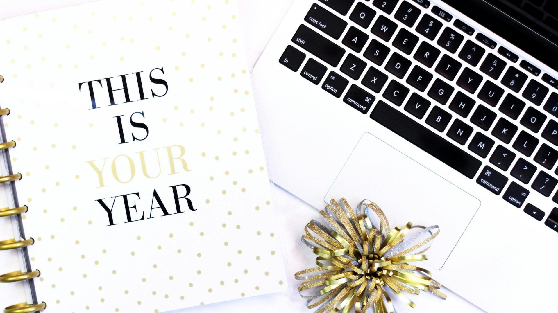 'This is your year' notepad alongside laptop